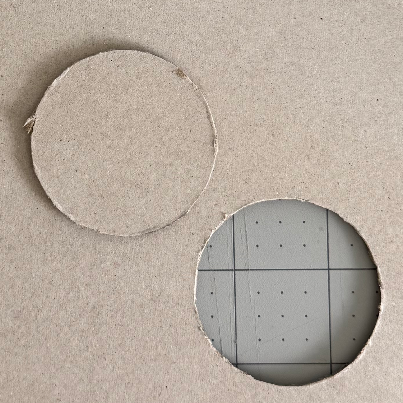 A chipboard circle removed from the surrounding board