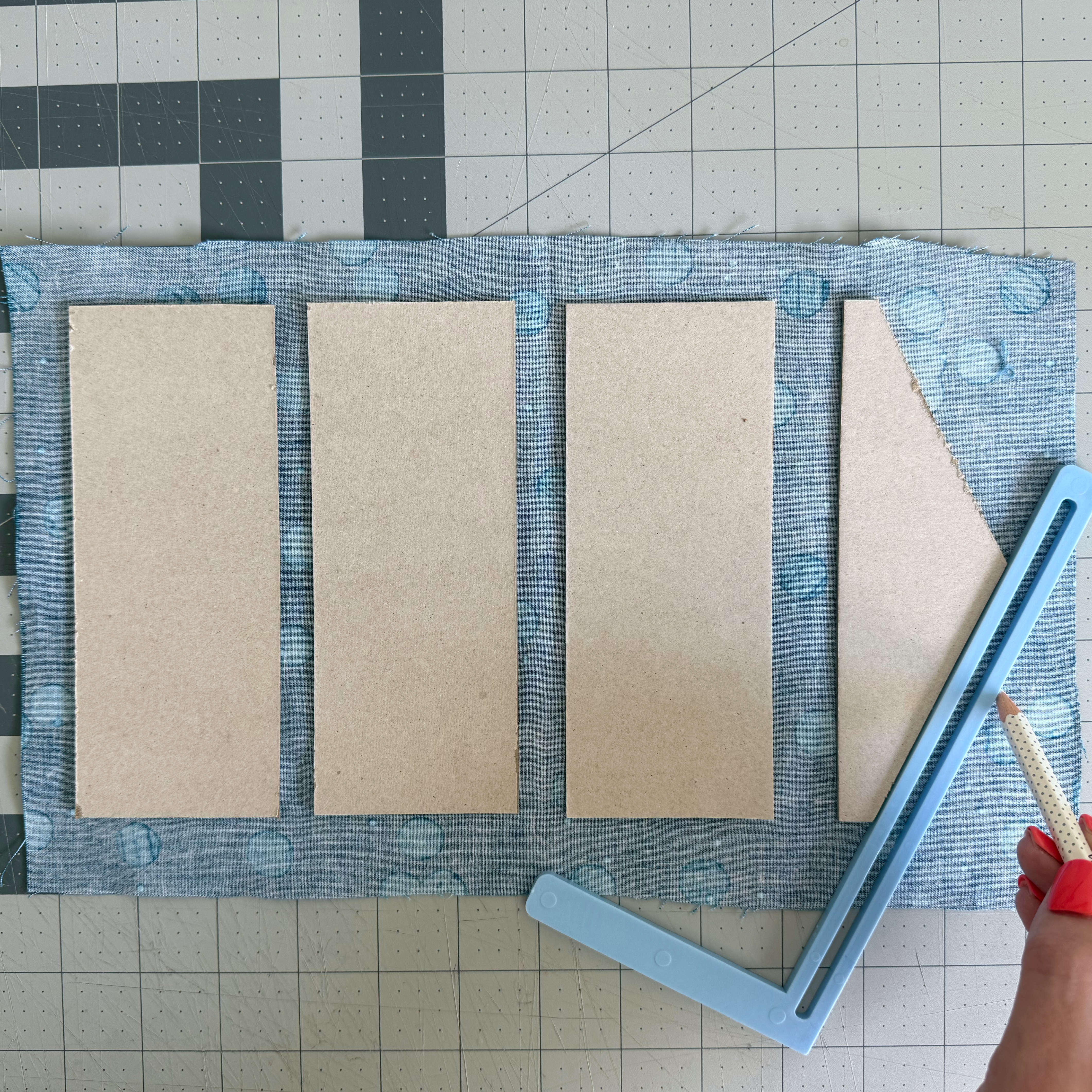 Fabric buffer marked around an irregular chipboard piece