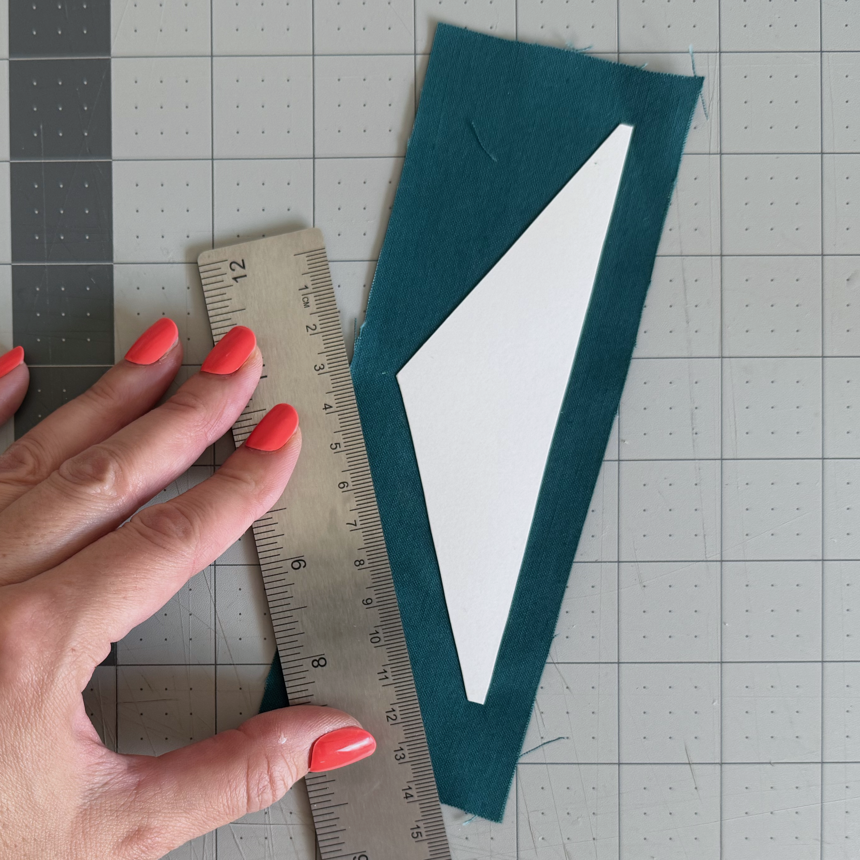 Fabric buffer marked around an irregular cardstock lining