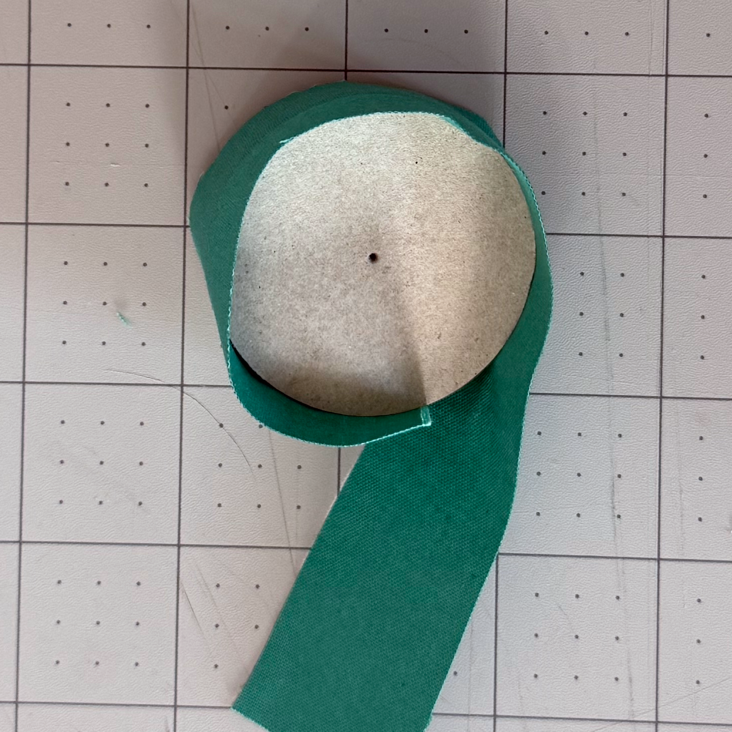 Fabric strip aligned around the edge of a chipboard circle