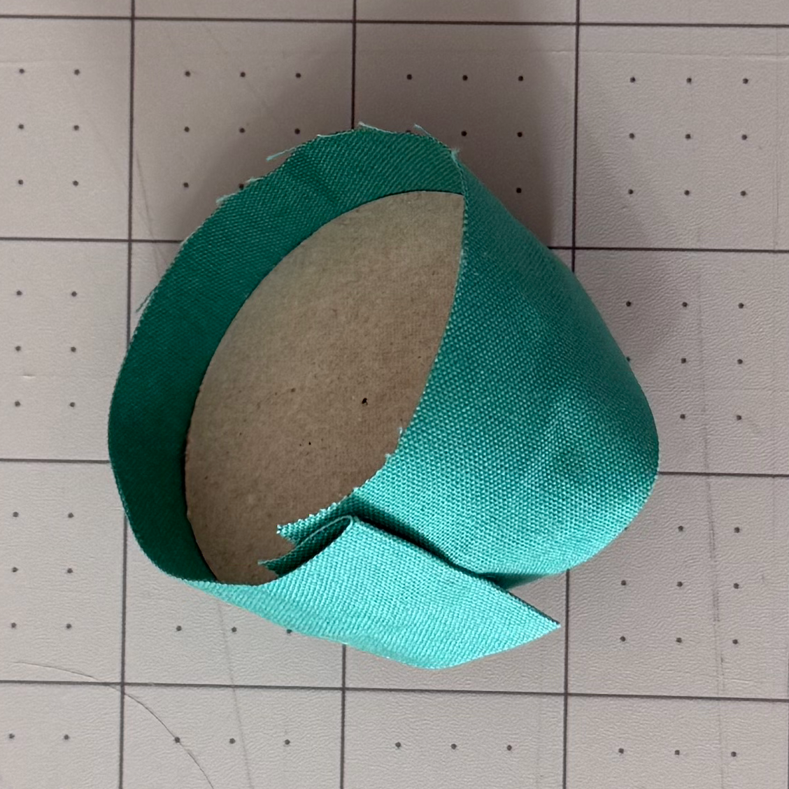 Fabric strip overlapping after wrapping the full chipboard perimeter