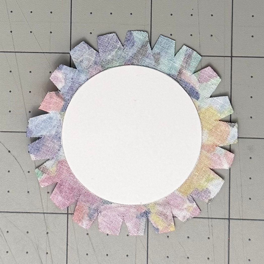 Triangular notches cut around a circular cardstock lining card