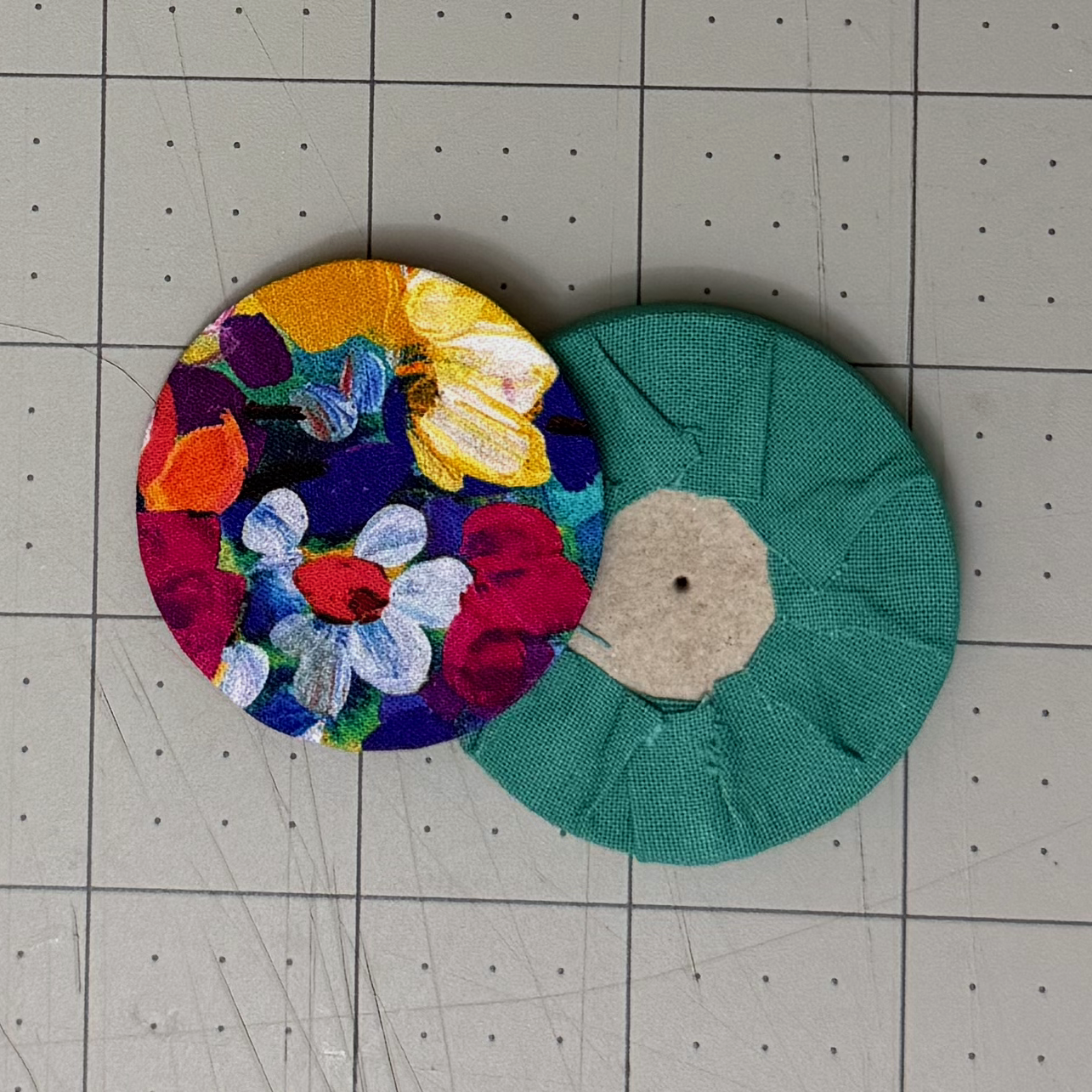 Front and back of completed fabric-wrapped circular panels